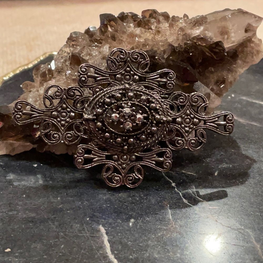 Vintage dark grey metal brooch with rhinestones